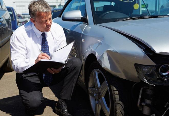 family buying auto insurance at agency office